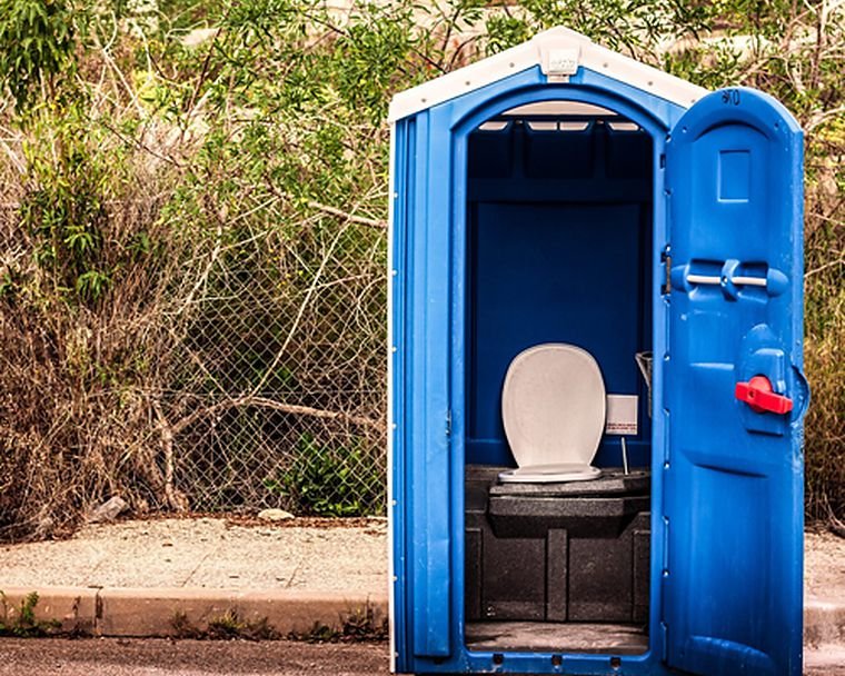Portable sanitation unit serviced in the field